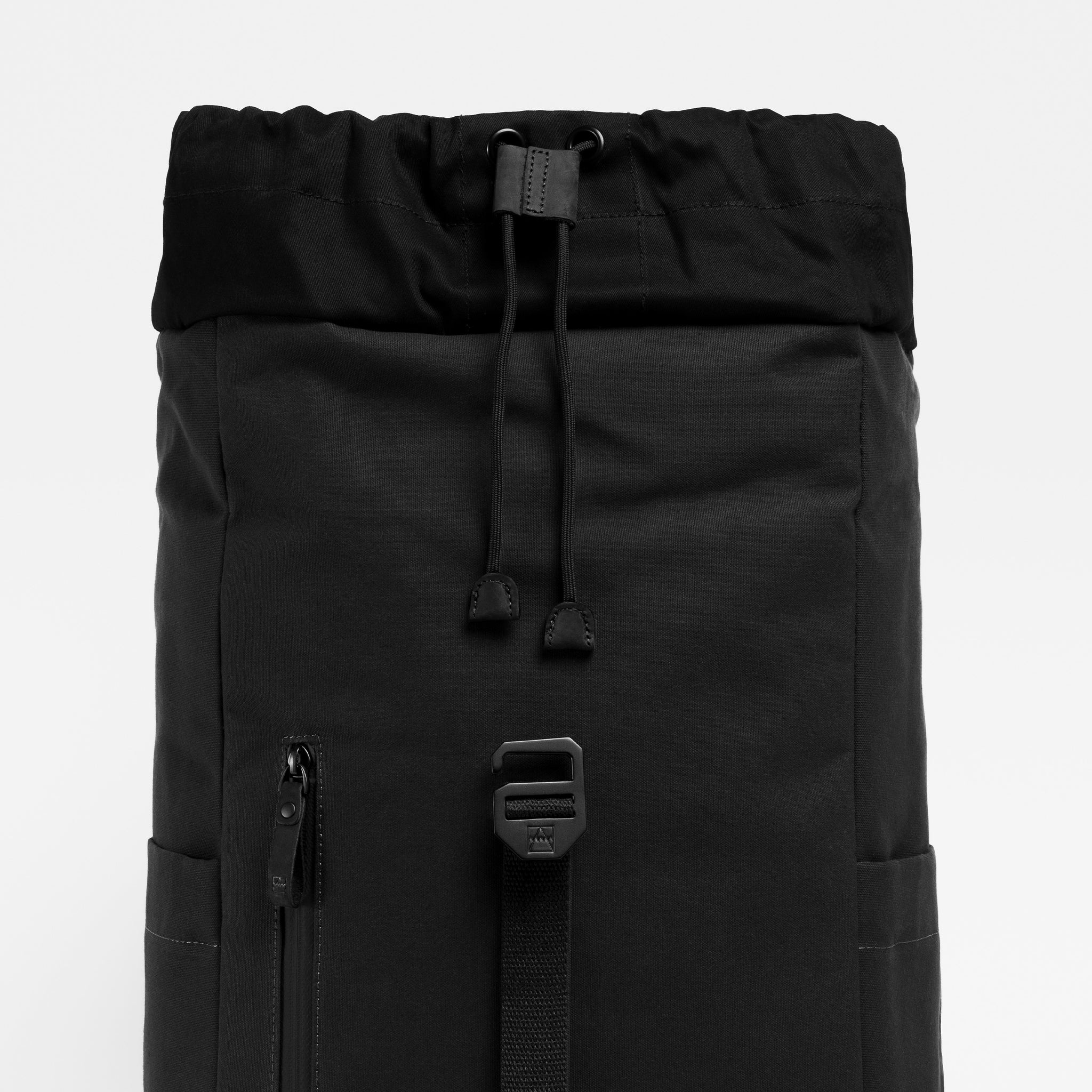 A studio shot of the drawstring closure on the Backpack 20L in All Black