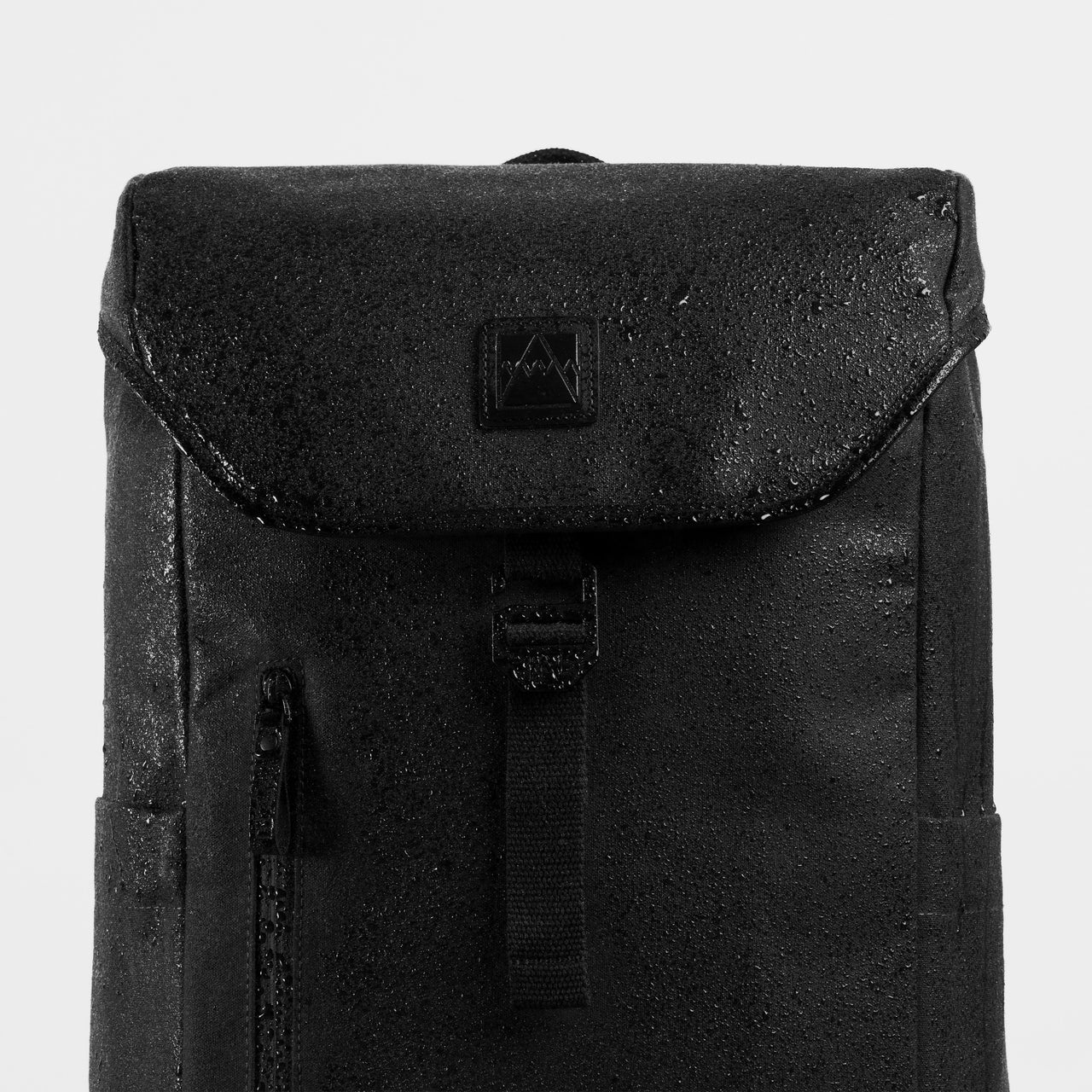 A studio shot of the water-resistant materials on the Backpack 20L in All Black