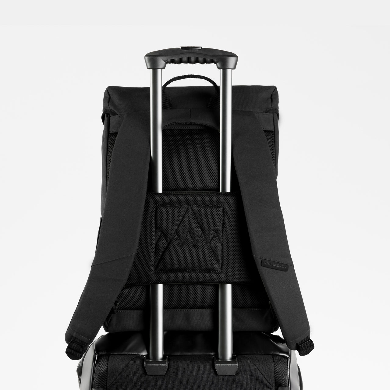 A studio shot of the luggage sleeve on the Backpack 20L in All Black