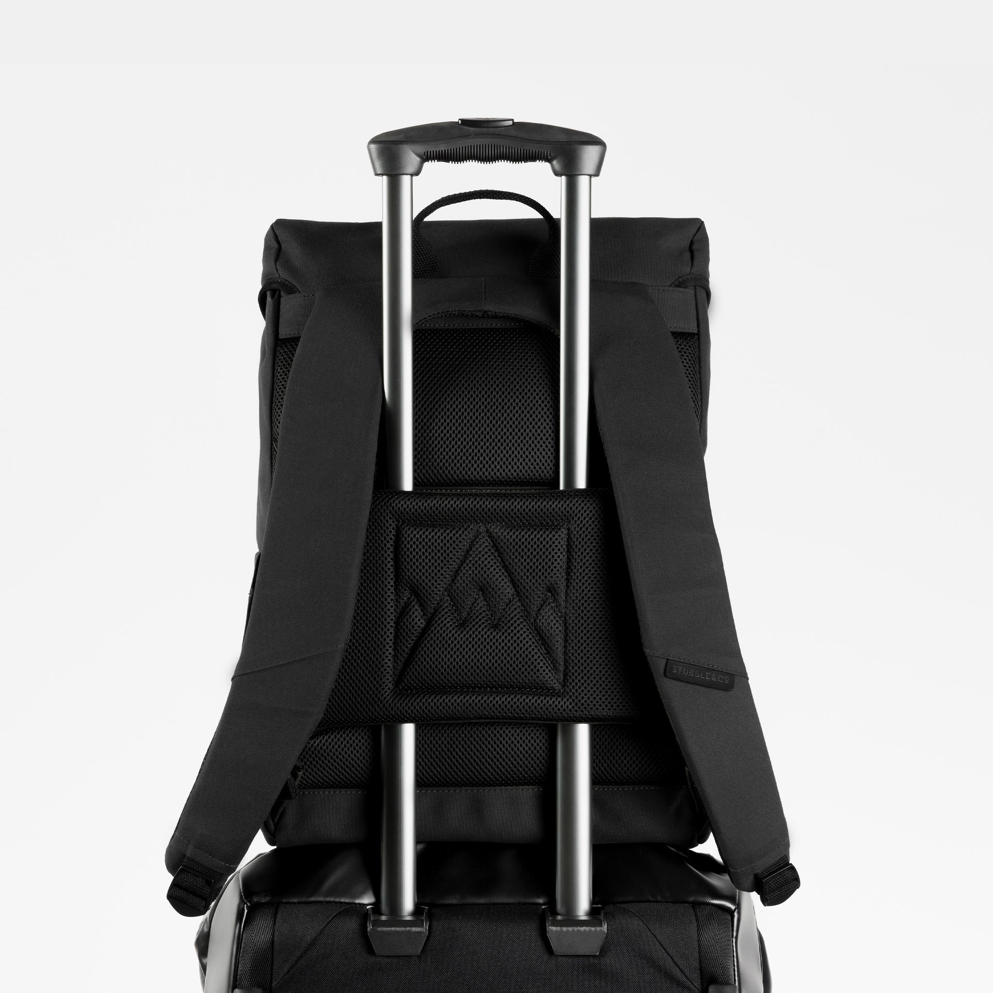 A studio shot of the luggage sleeve on the Backpack 20L in All Black