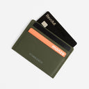 A studio shot of cards inside the Card Holder in Urban Green