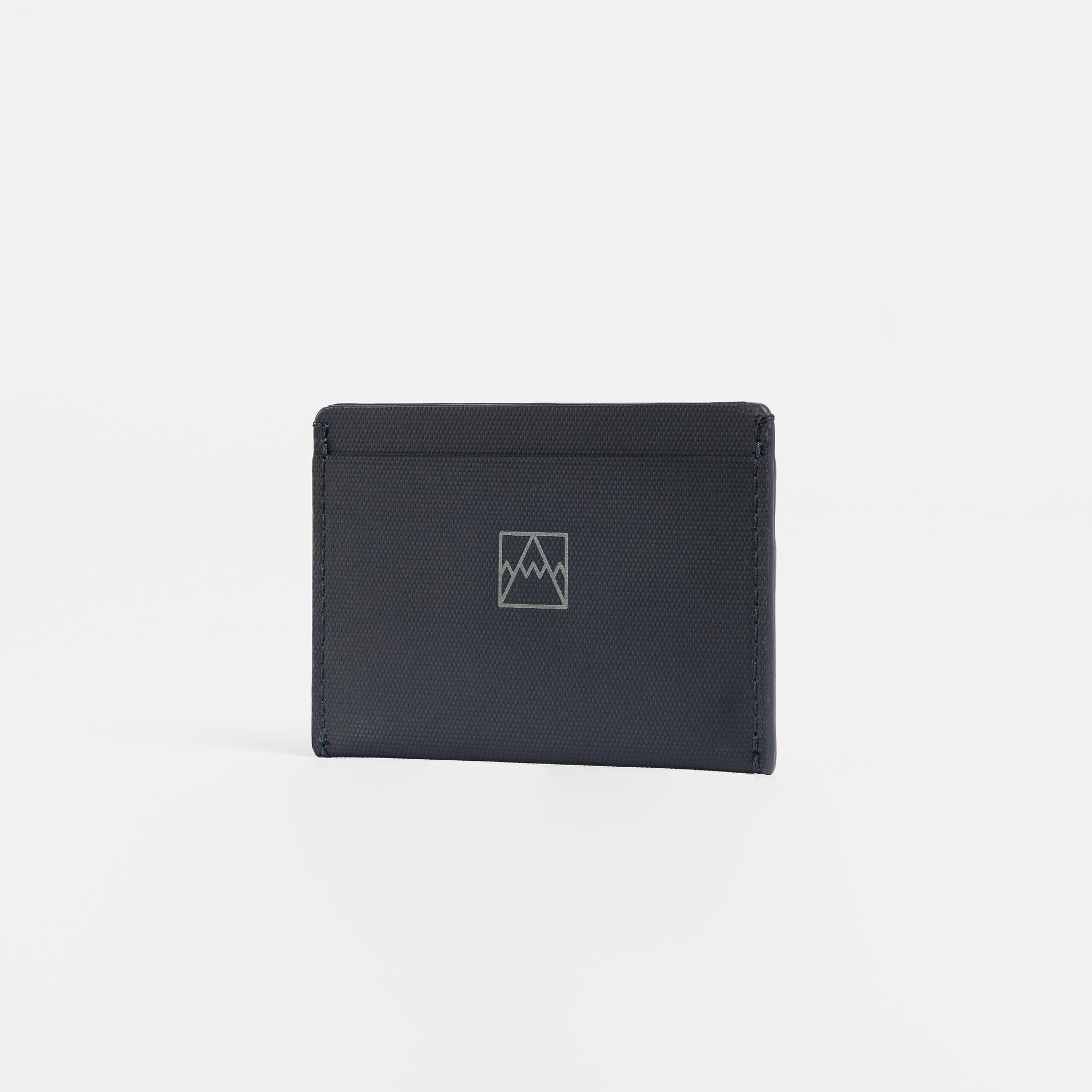 A studio shot of the front of the Card Holder in Midnight Blue