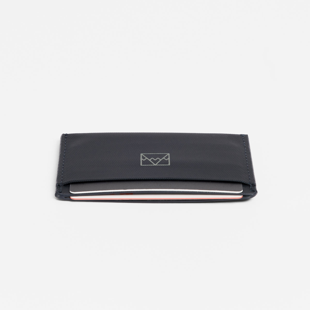 A studio shot of the end of the Card Holder in Midnight Blue