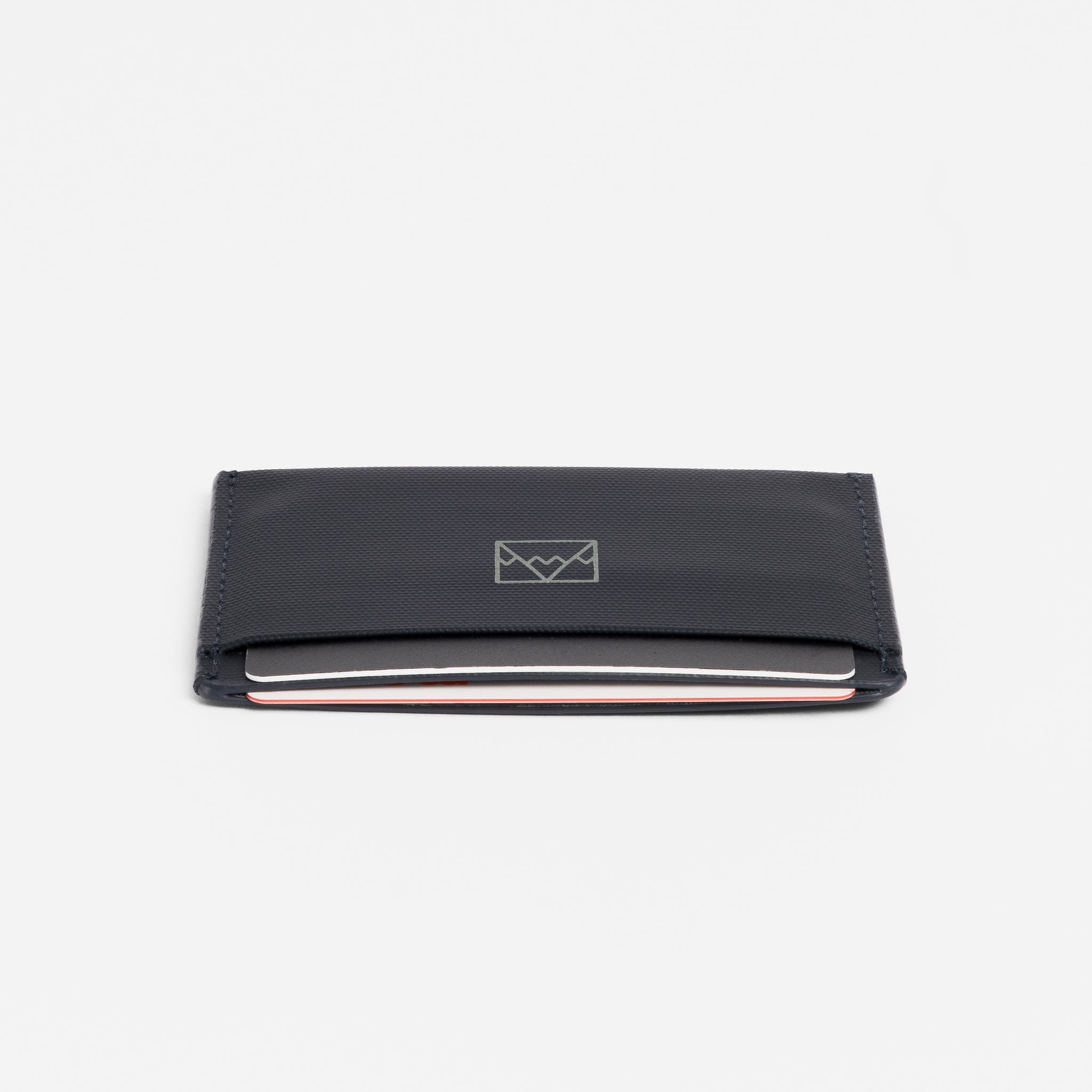 A studio shot of the end of the Card Holder in Midnight Blue