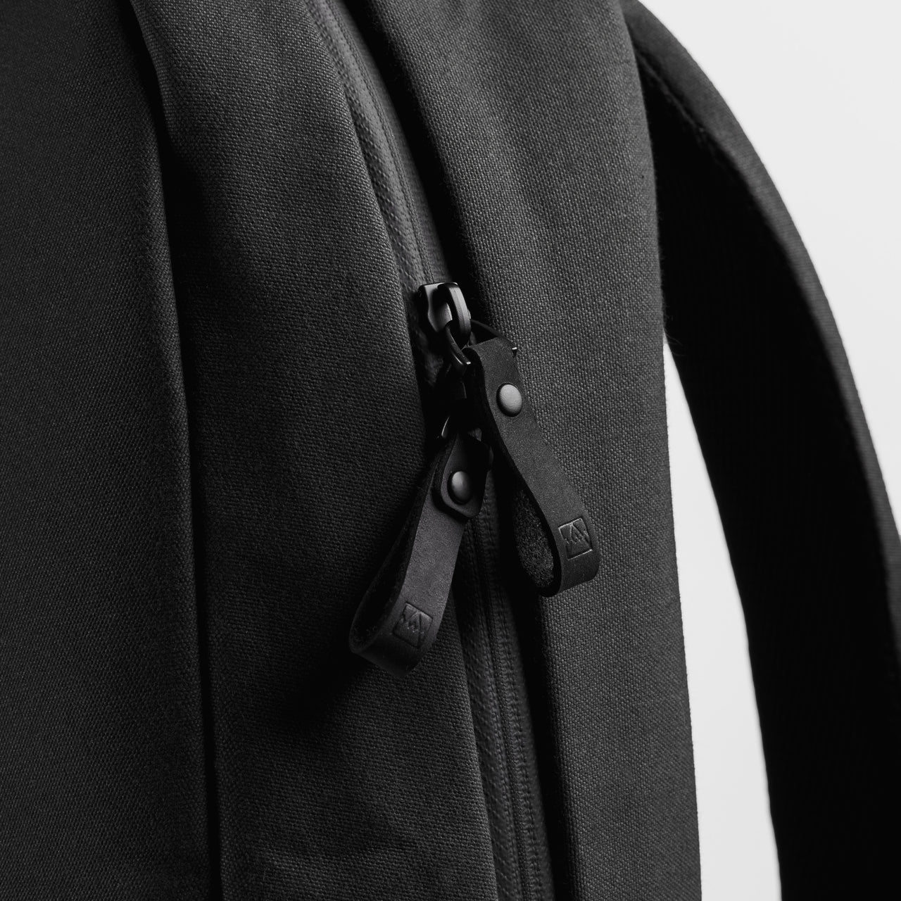 A close up studio shot of the ultra-reliable zips on the Classic Backpack 15L in All Black