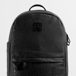 A studio shot of the water-resistant materials on the Classic backpack 15L in All Black