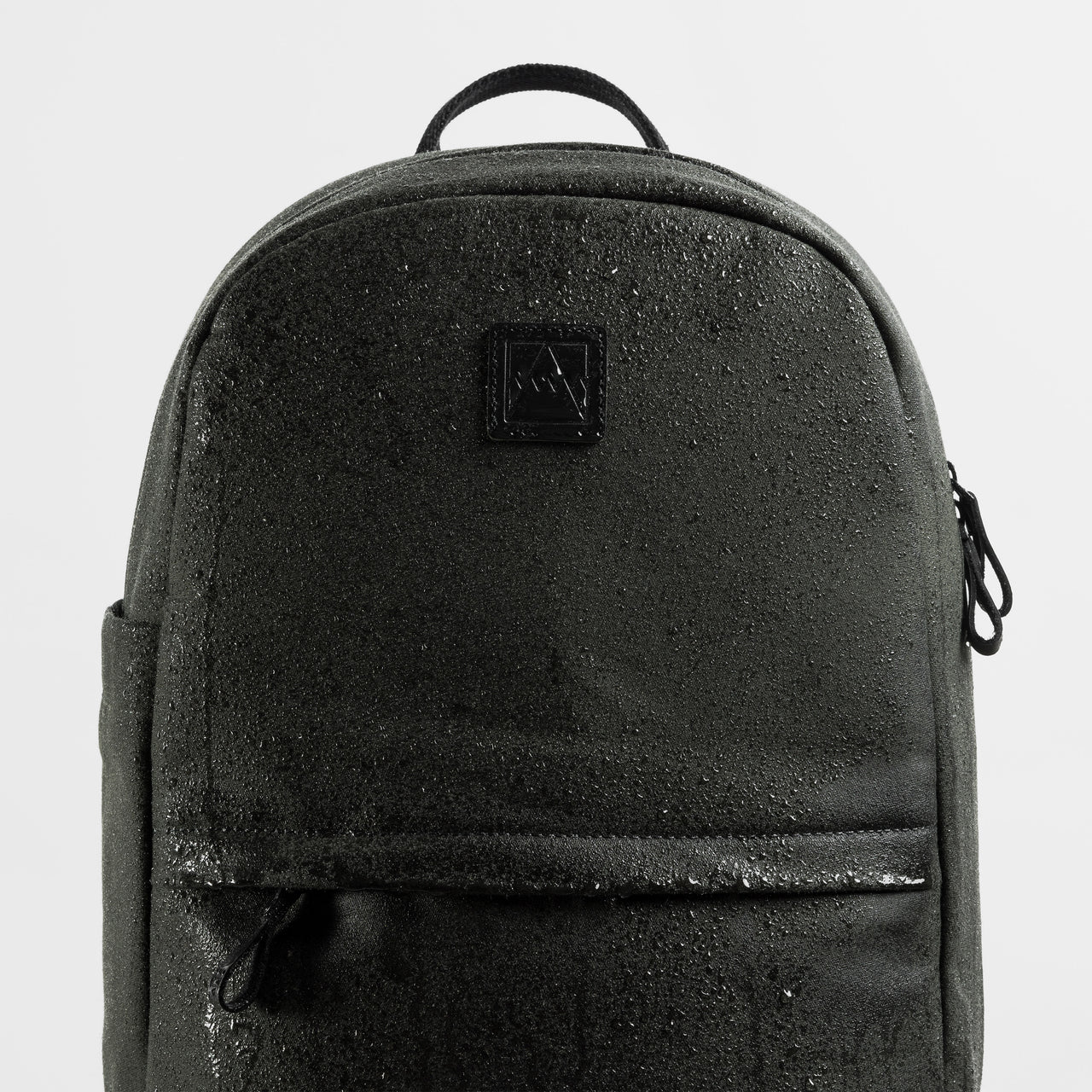 A studio shot of the water resistant material on the Classic Backpack 15L in Pirate