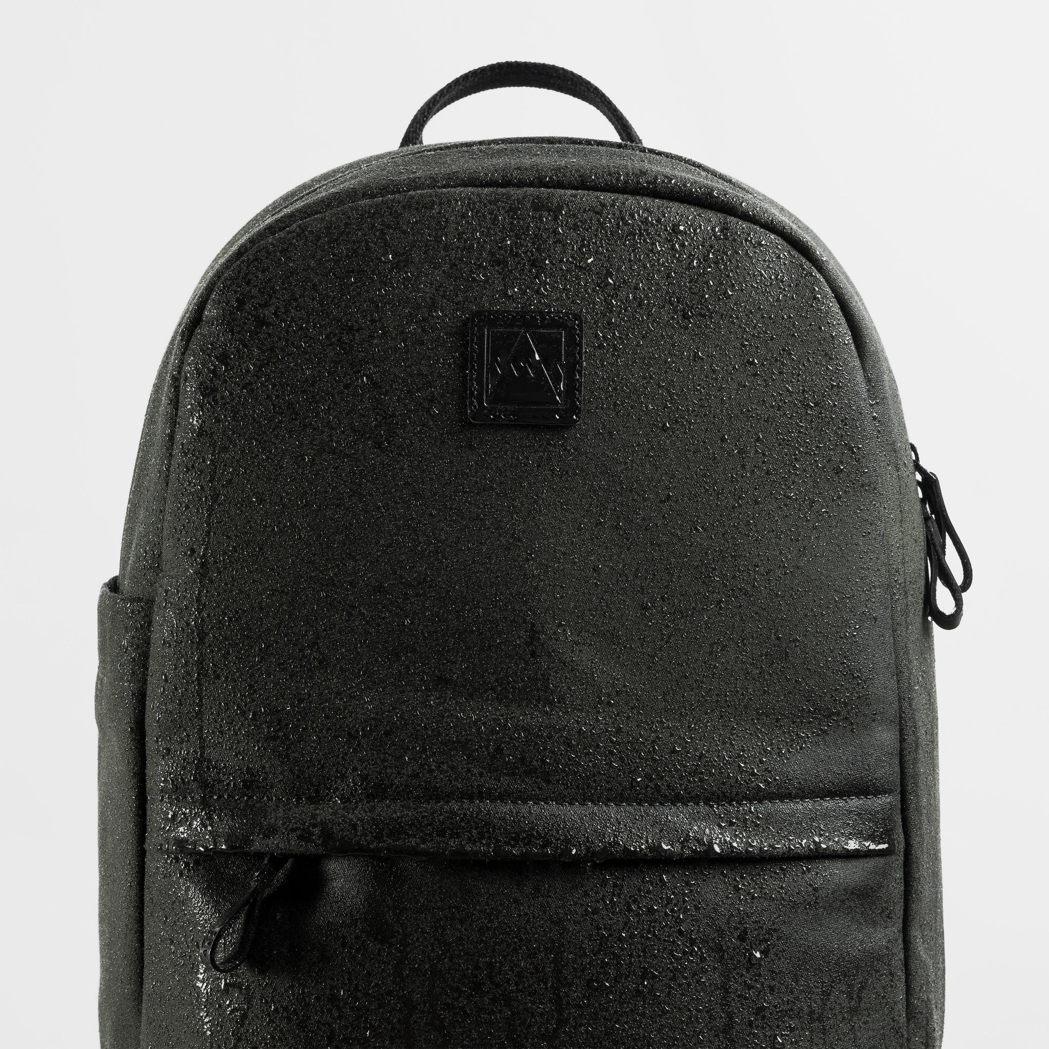 A studio shot of the water resistant material on the Classic Backpack 15L in Pirate