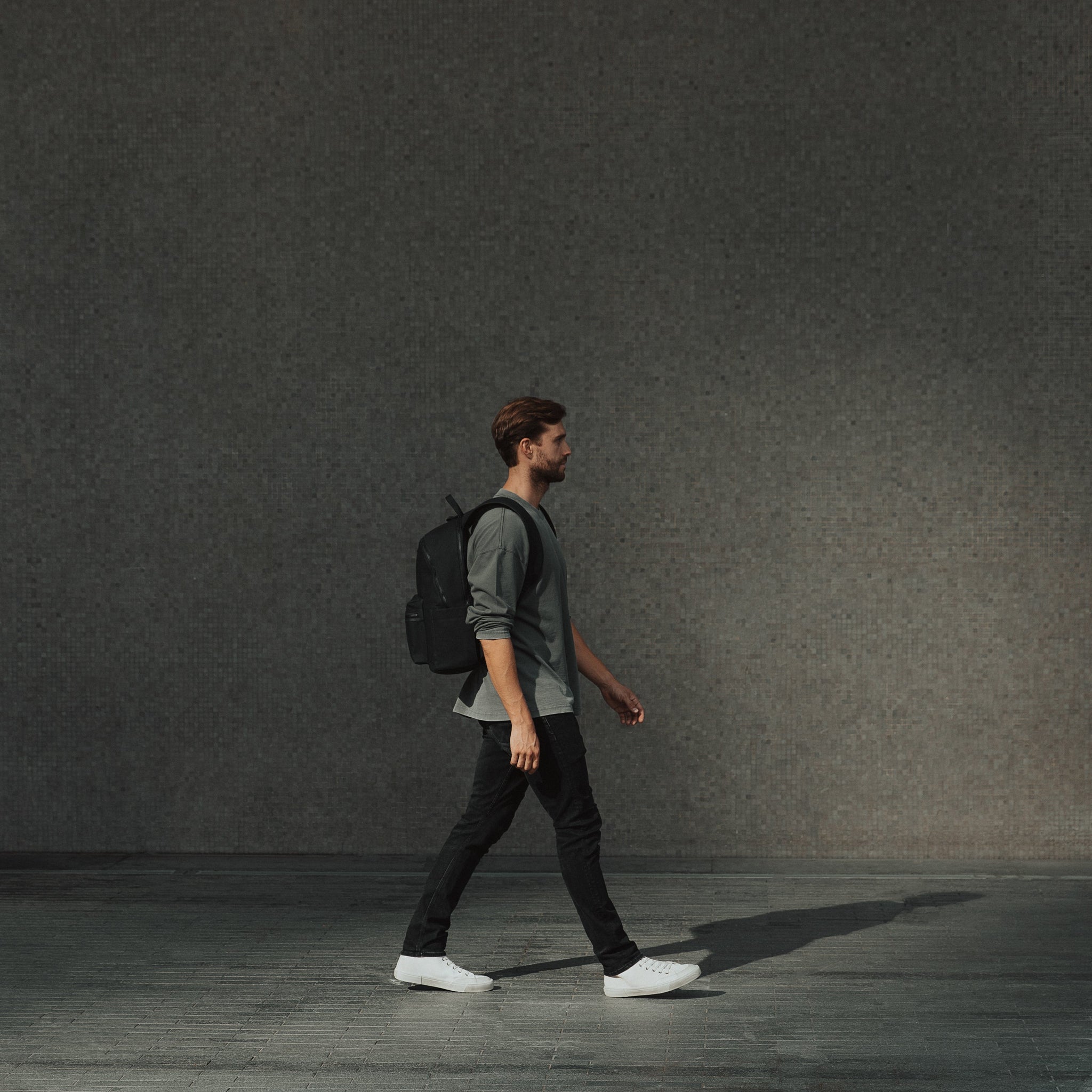 Man wearing The Commuter All Black walking