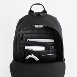 The Commuter Backpack in Black and Gold open