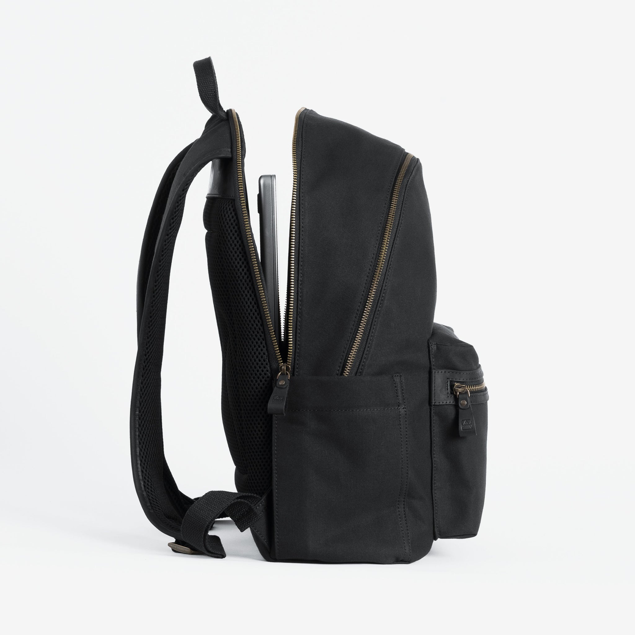 The Commuter Backpack in Black and Gold open