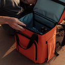 The Cooler Backpack in Ember Orange open