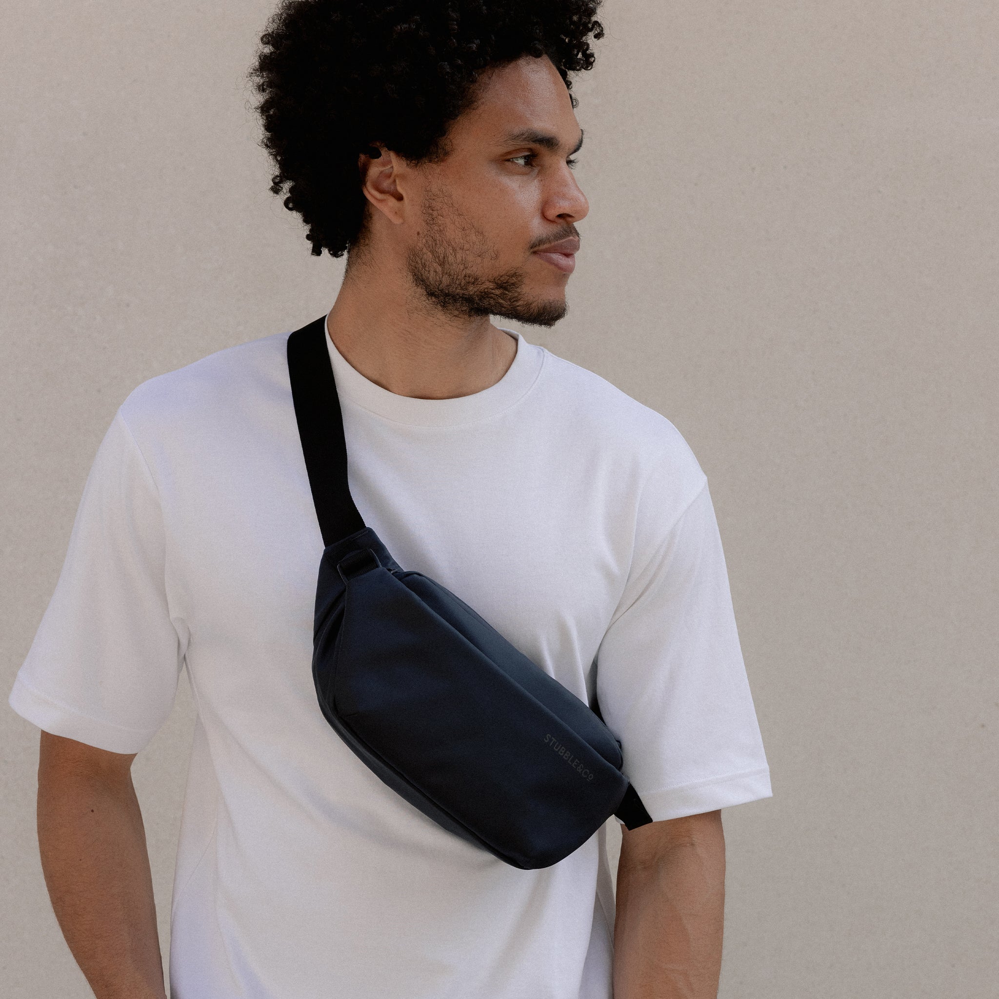 A man wearing a Midnight Blue Crossbody on his front