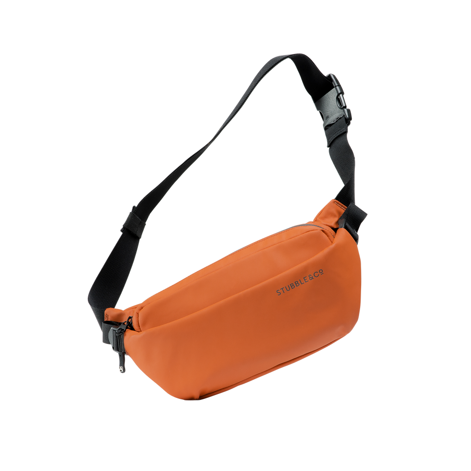 A studio shot of the front and side of a crossbody as cut out transparent PNG- orange