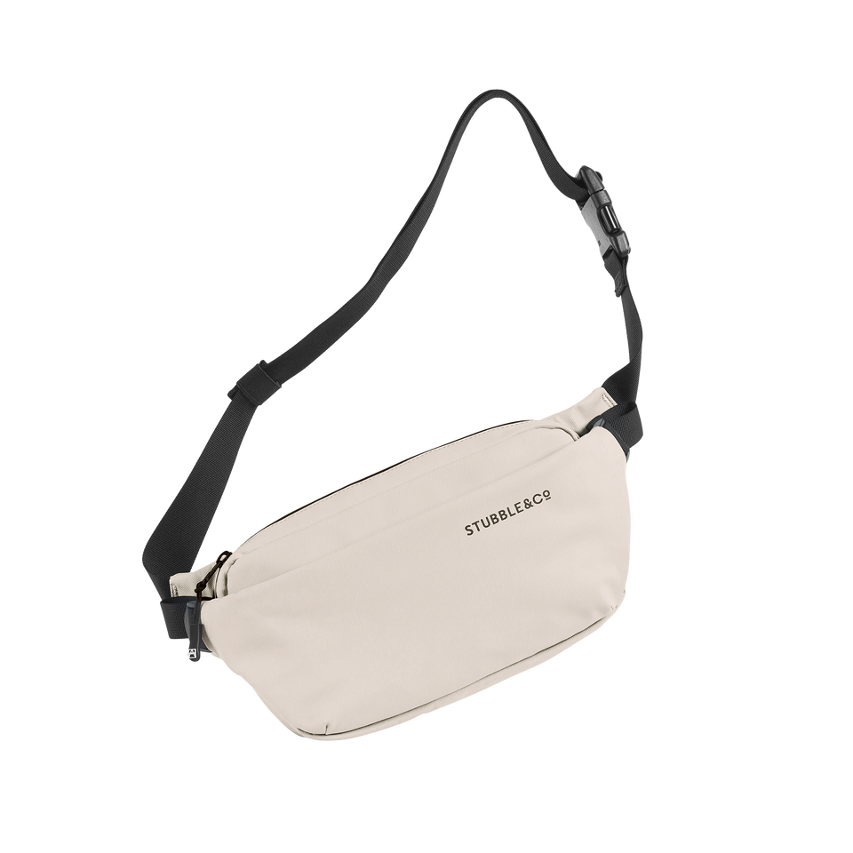 A studio shot of the front and side of a crossbody as cut out transparent PNG- sand