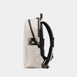 A studio shot of the bottle pocket on the side of the Everyday Backpack 15L in Sand