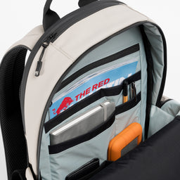 A studio shot of the interior organisation and blue lining of the Everyday Backpack 15L in Sand