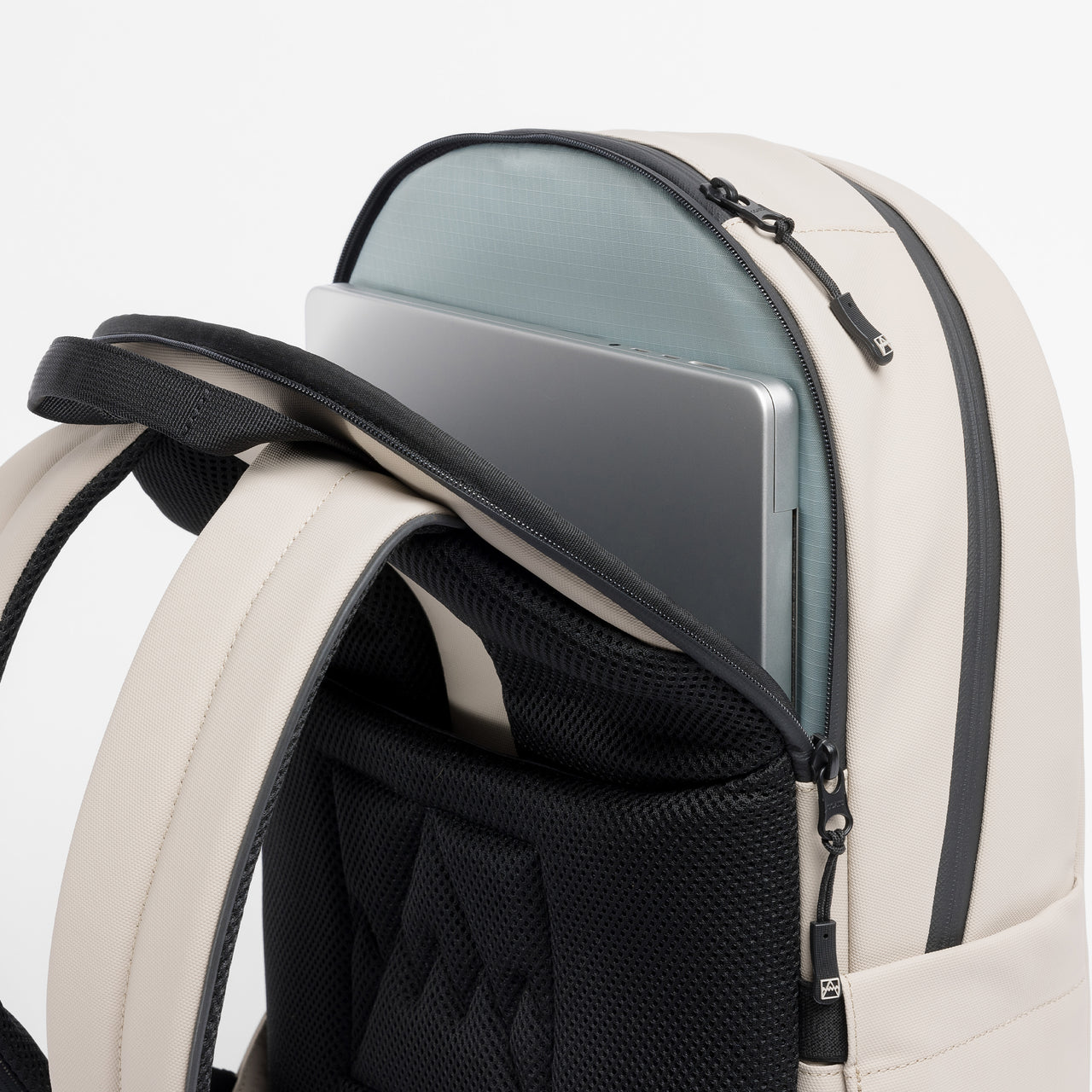 A studio shot of the laptop compartment of the Everyday Backpack 15L in Sand