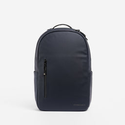 A studio shot of an Everyday Backpack 15L in Midnight Blue showing the front