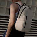 A close up of an Everyday Backpack 15L n Sand on a woman's back