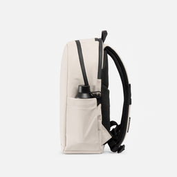 A studio shot of the bottle pocket of the Everyday Backpack 20L in Sand 
