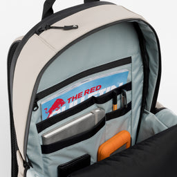 A studio shot of the interior organisation and blue lining of the Everyday Backpack 20L in Sand 
