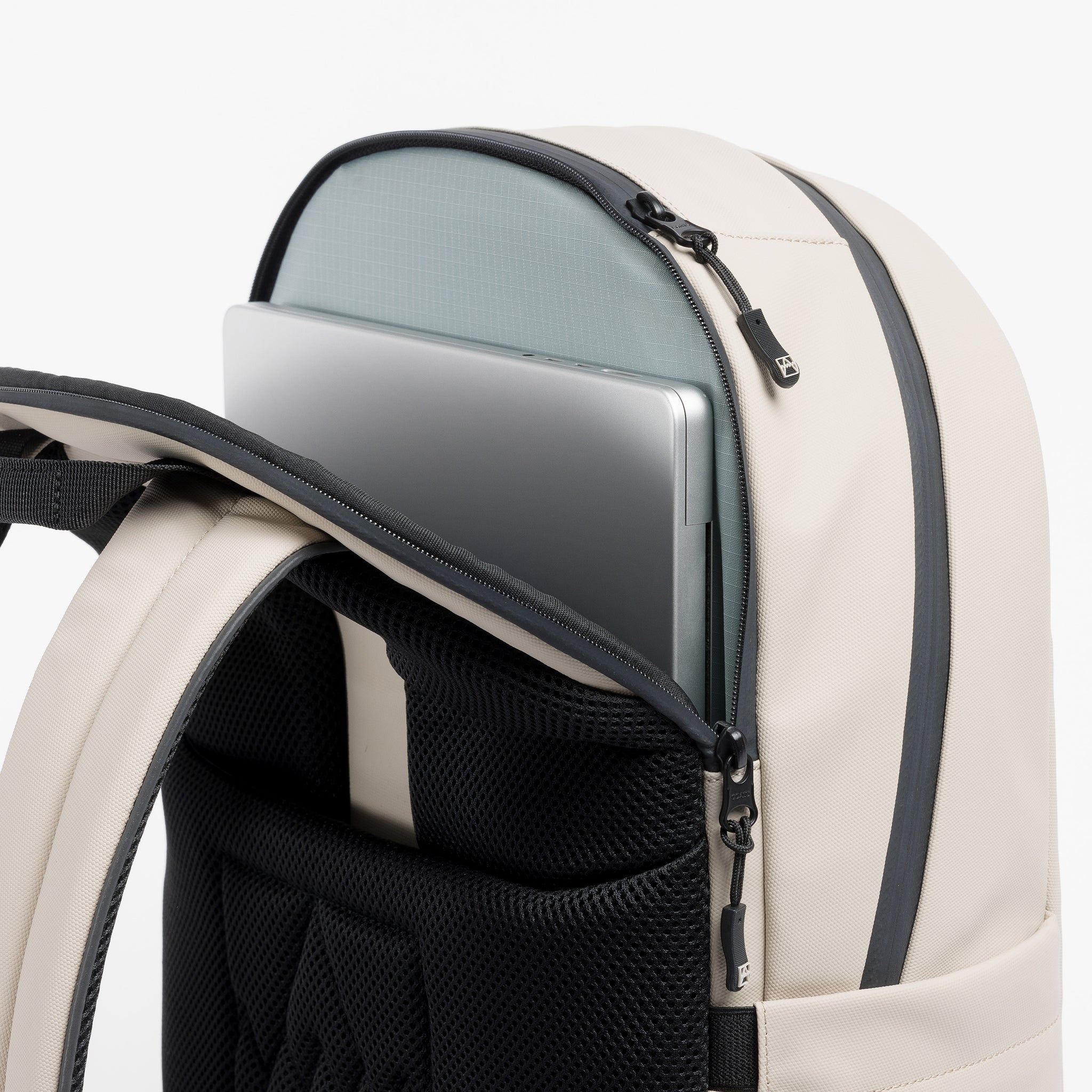 A studio shot of the laptop compartment of the Everyday Backpack 20L in Sand 