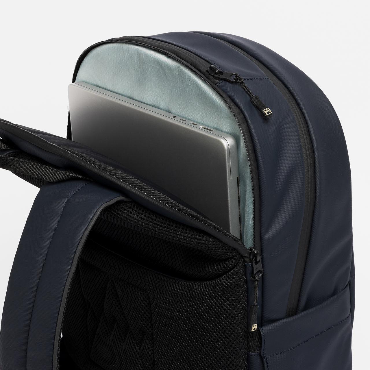 A studio shot of the laptop compartment on the Everyday Backpack in Midnight Blue