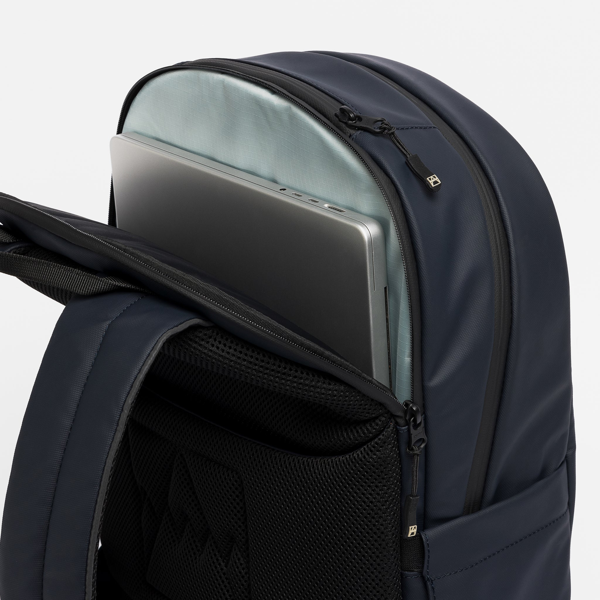 A studio shot of the laptop compartment on the Everyday Backpack in Midnight Blue