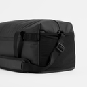 A studio shot of the mesh pocket at the end of the Gym Duffel 25L in All Black