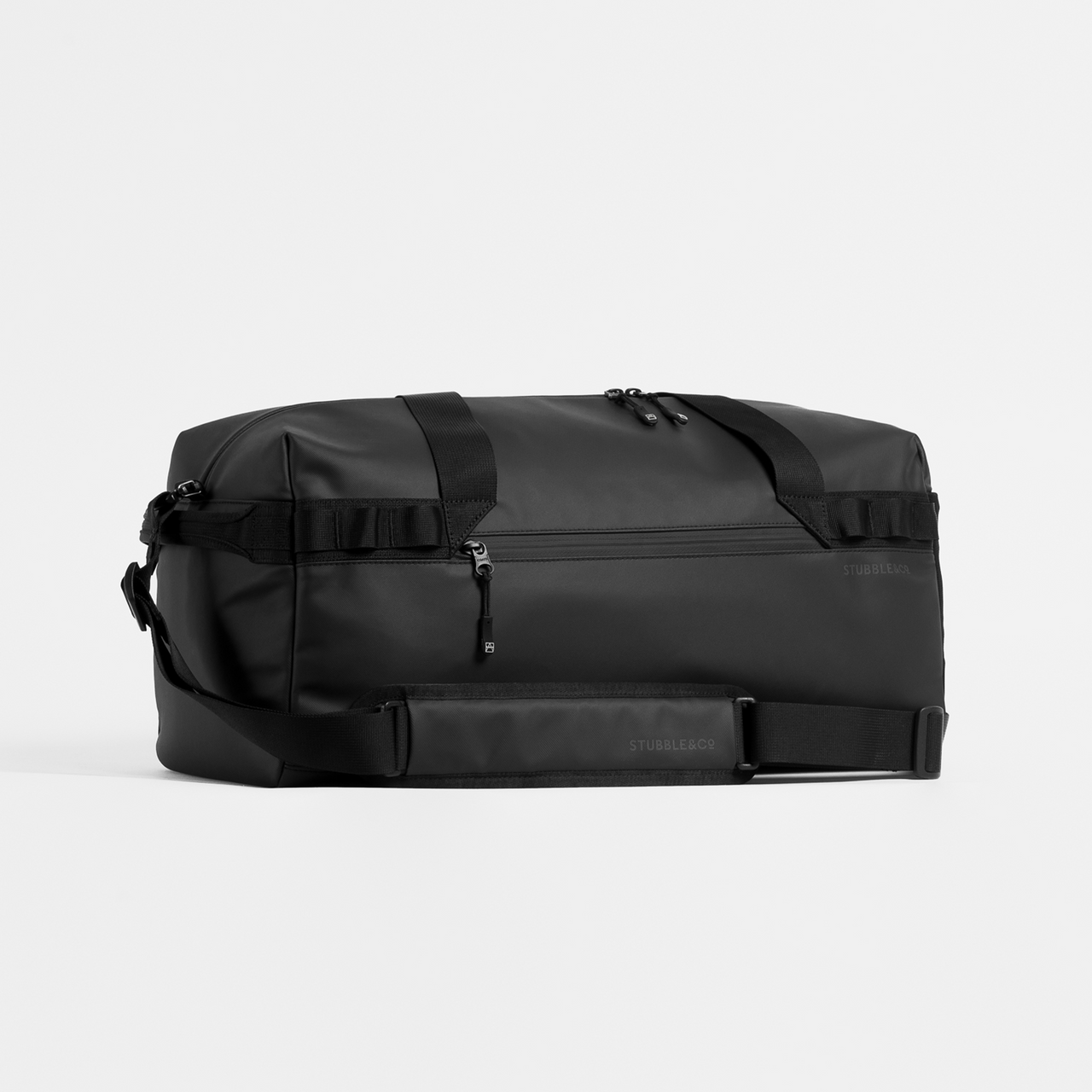 A studio shot of the gym duffel in All Black placed at an angle so that the shoulder strap in visible