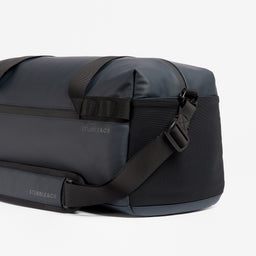 A studio shot of the end elastic pocket on the Midnight Blue Gym Duffel 25L