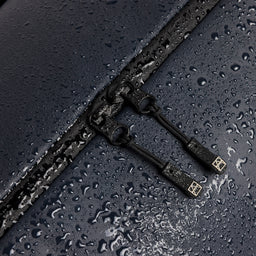 A studio shot showing the waterproof material on the Gym Duffel 25L in Midnight Blue
