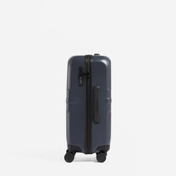 A studio shot of the side grab handle and lock on the Hardshell 40L in Midnight Blue