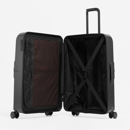 A studio shot of the Hardshell 95L in All Black standing and open