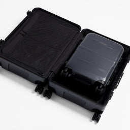 A studio shot of the Hardshell 95L in Midnight Blue with a Hardshell 40L inside