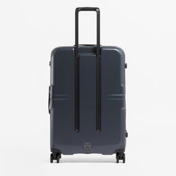 A studio shot of the back of the Hardshell 95L in Midnight Blue