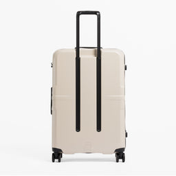 A studio shot of the back of the Hardshell 95L in Sand