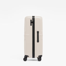 A studio shot of the side grab handle and side of the Hardshell 95L in Sand