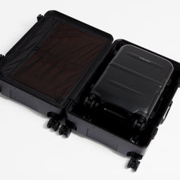 A studio shot of the Hardshell Pro 40L in All Black nested inside the Hardshell Pro 95L