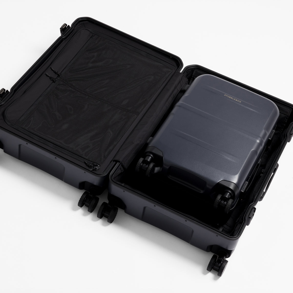 A studio shot of the Hardshell Pro 40L in Midnight Blue nested inside the Hardshell Pro 95L