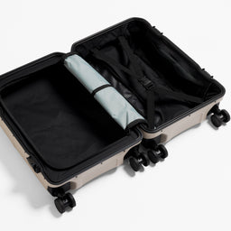 A studio shot of the inside and compression strap on the Hardshell Pro 40L in Sand
