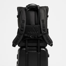 A Roll Top 20L on the handle of  the Hardshell 40L in All Black