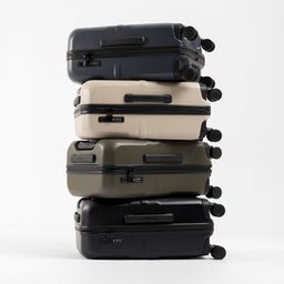 A studio creative shot of all of the Hardshell 40L stacked on top of each other in each colour including All Black