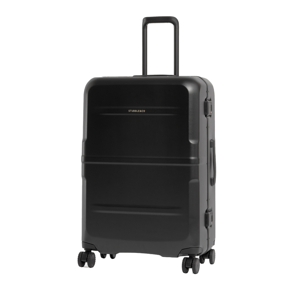 A black hard-shell spinner suitcase with an extended telescoping handle, shown from a three-quarter angle on a plain white background.