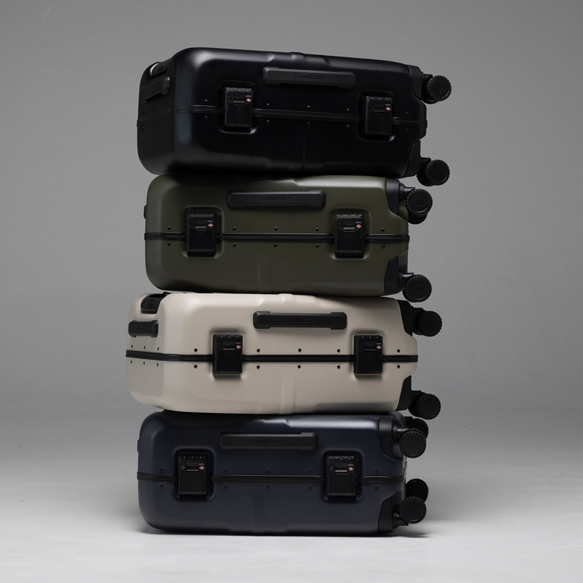 A studio shot of all of the Hardshell Pro 40L stacked on each other in all colours including All Black