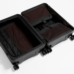 A studio shot of the inside and compression straps in the Hardshell Pro 95L in All Black