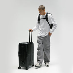 A man with the Hardshell Pro 95L in All Black