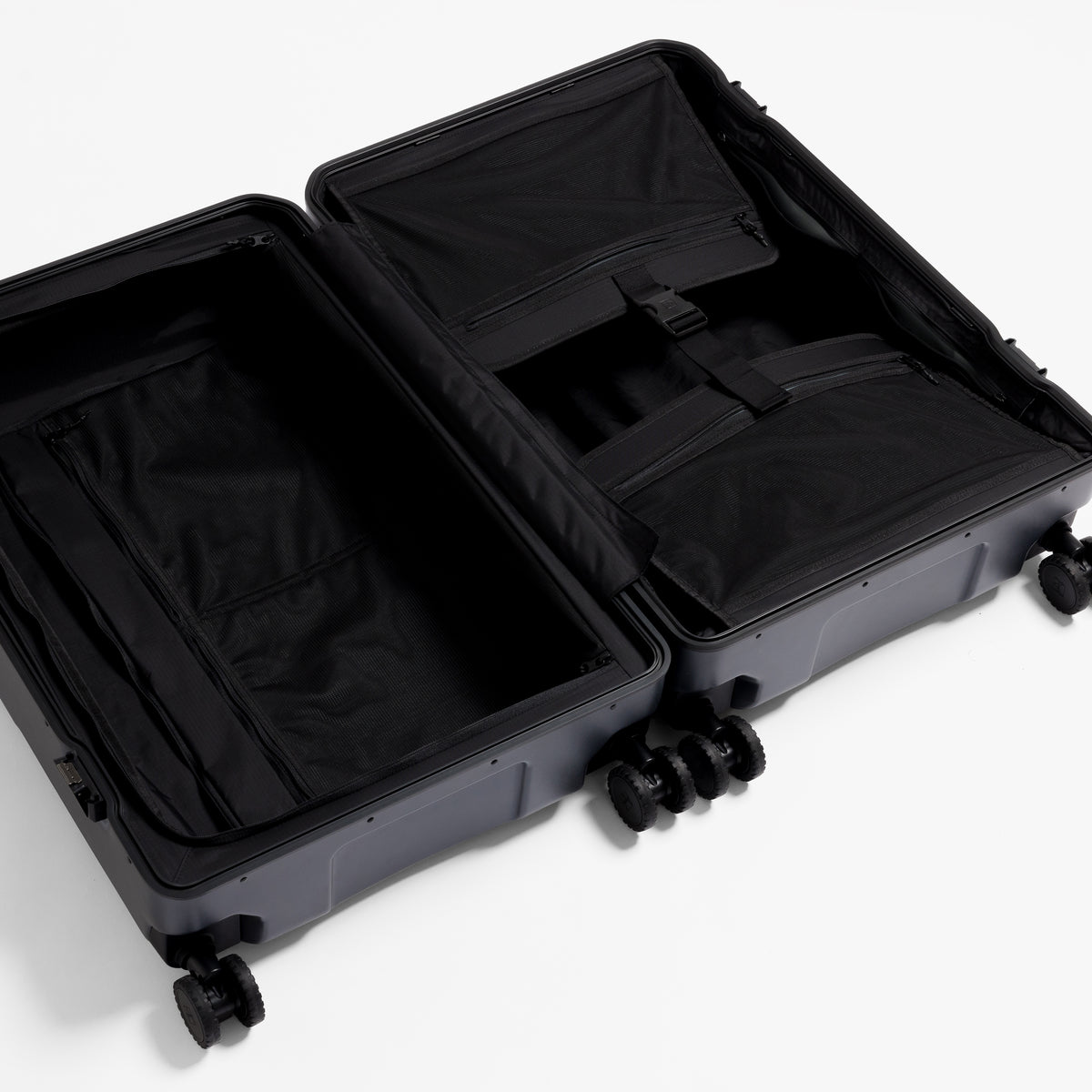 A studio shot of the inside and compression strap in the Hardshell Pro 95L in Midnight Blue