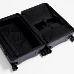 A studio shot of the inside and compression strap in the Hardshell Pro 95L in Midnight Blue